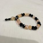 Black pink gold bracelet.