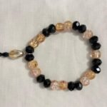 Black pink gold bracelet.