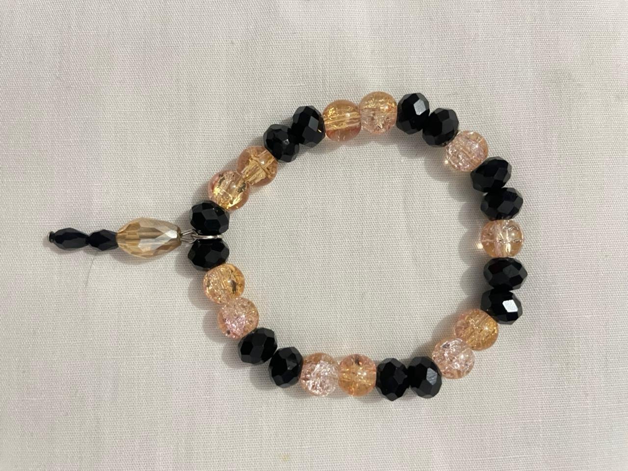 Black pink gold bracelet.