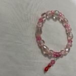 Pink beaded bracelet.