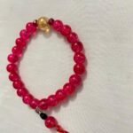 Magenta gold beaded bracelet.