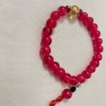 Magenta gold beaded bracelet.