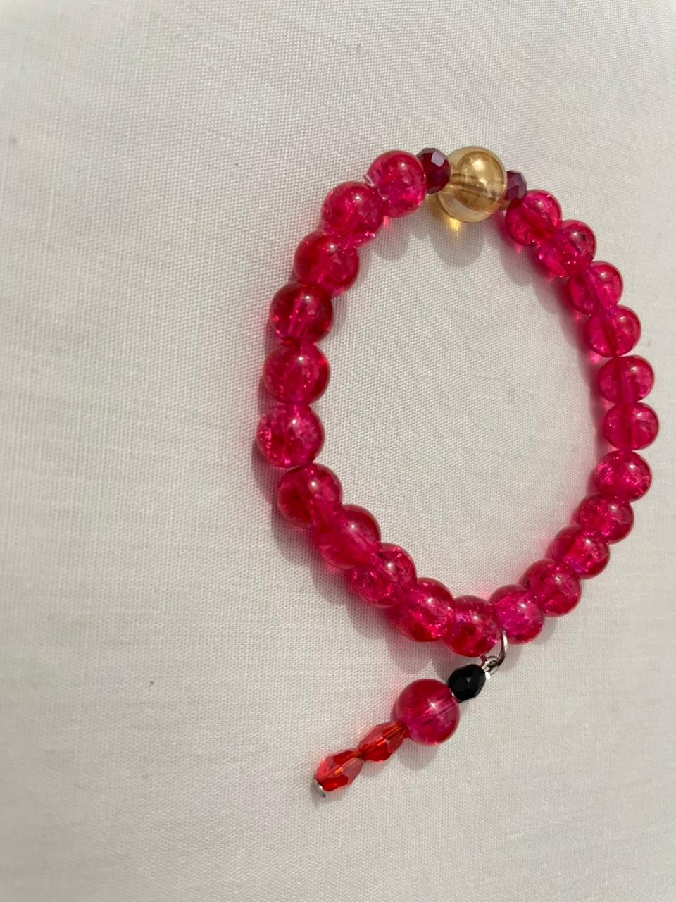 Magenta gold beaded bracelet.