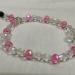 Clear pink beaded bracelet.