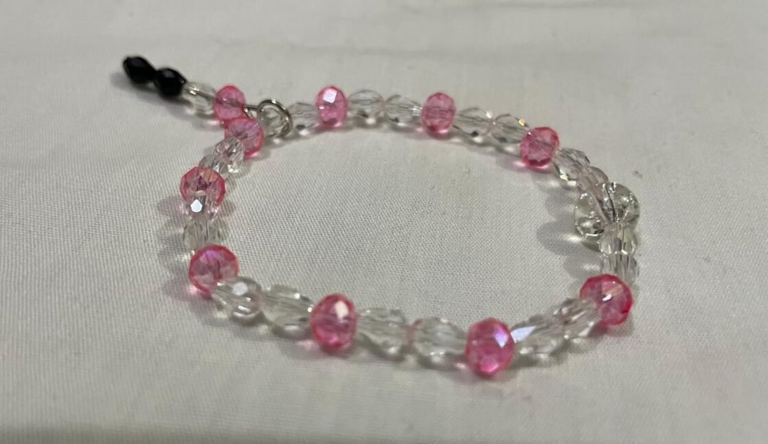 Clear pink beaded bracelet.
