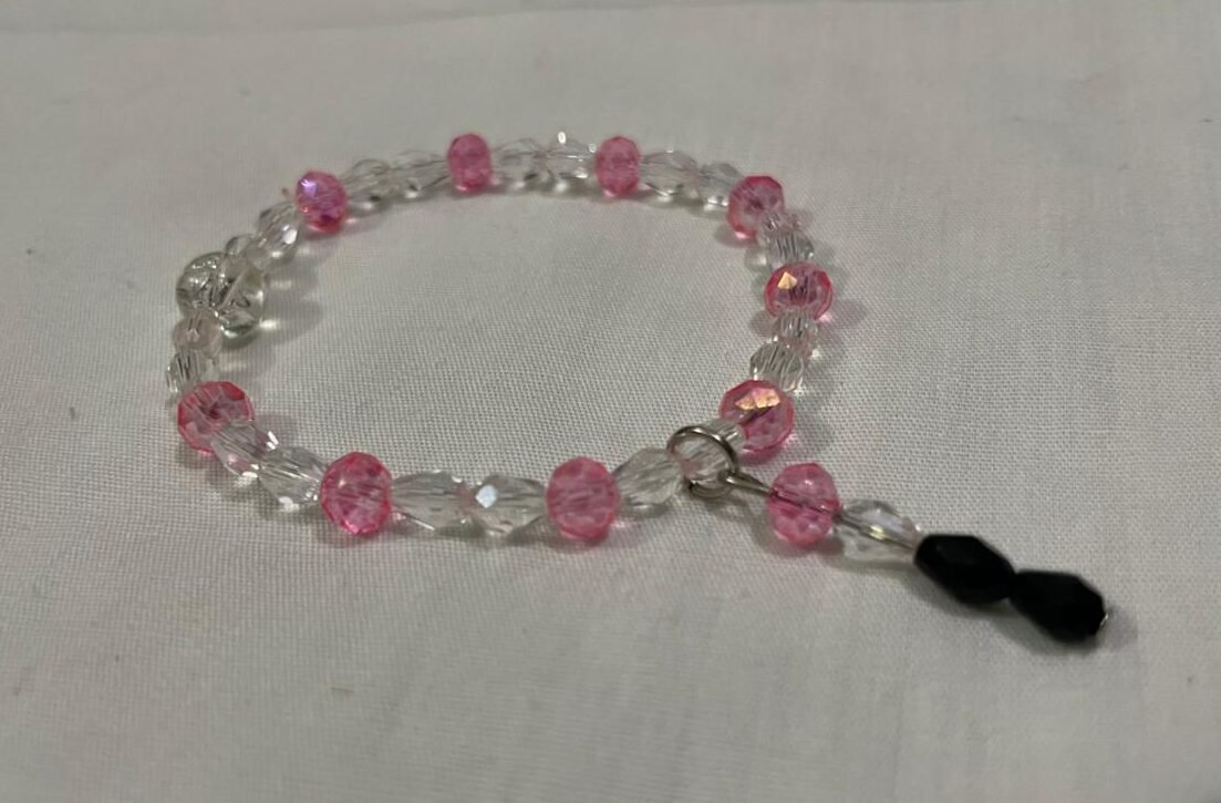 Clear pink beaded bracelet.