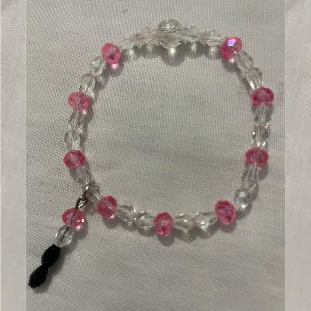 Clear pink beaded bracelet.