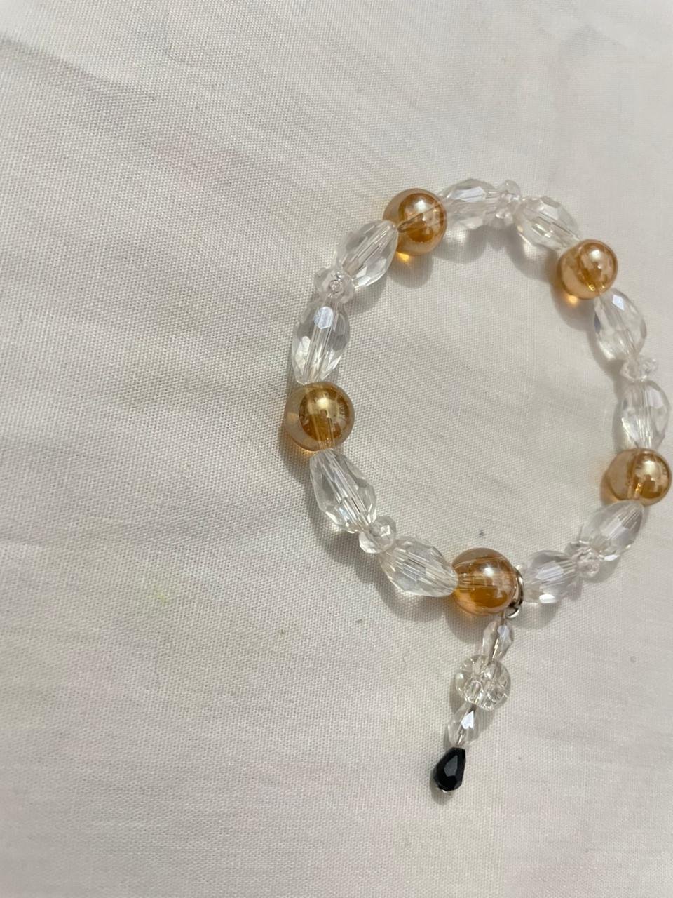 Gold clear bracelet.