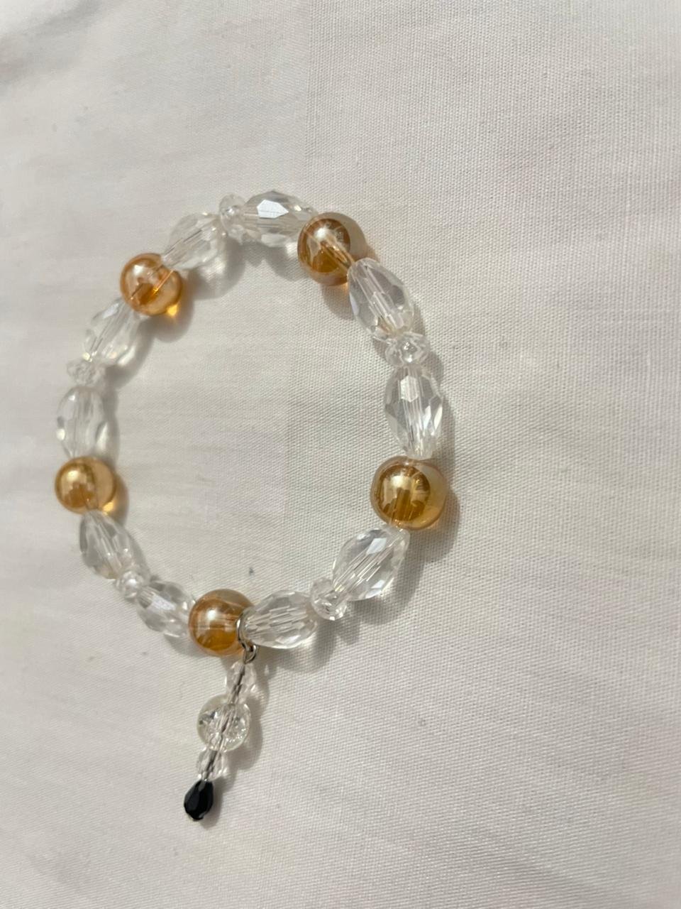 Gold clear bracelet.